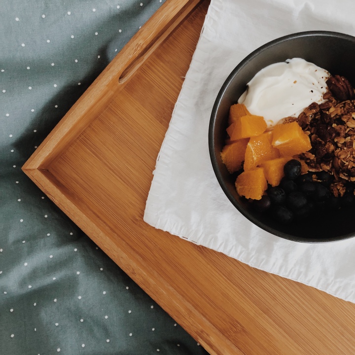 Orange and cranberry granola with yoghurt, oranges and blueberries.